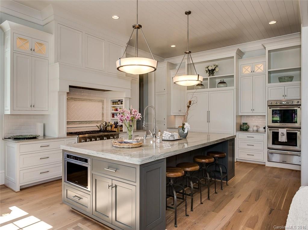 8405 Eagle Glen Charlotte, NC 28210 - Photo 6 of 24 a kitchen with stainless steel appliances a stove a sink and a refrigerator