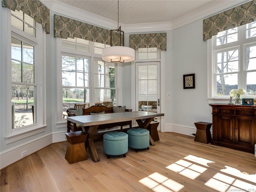 8405 Eagle Glen Charlotte, NC 28210 - Photo 8 of 24 a view of a dining room with furniture window and wooden floor