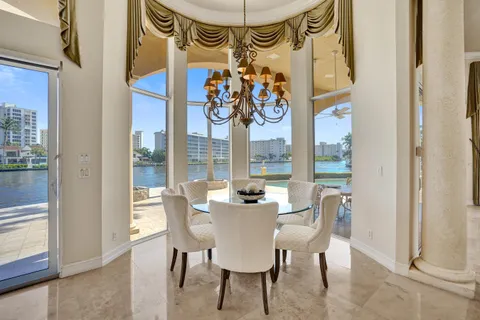 a view of a dining room with furniture and a window