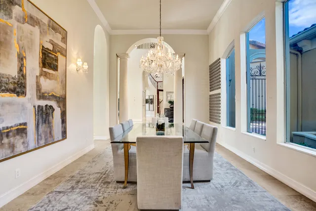 a dining room with furniture and window