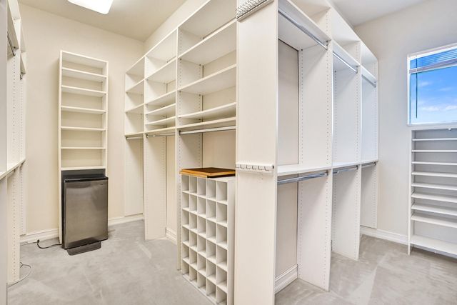 a view of closet area with rug