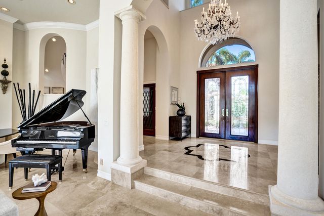 a view of hall way with furniture and gym equipment