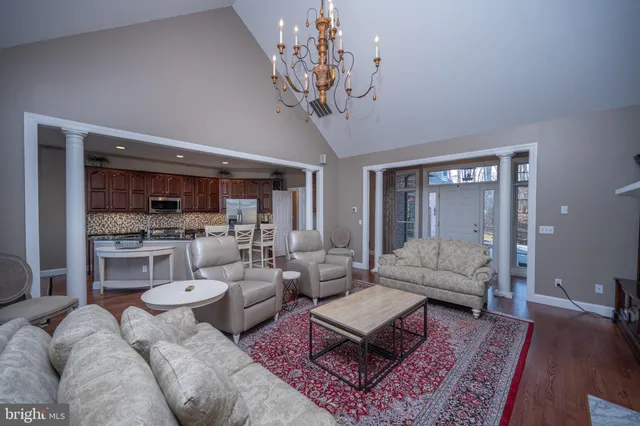 a large kitchen with granite countertop a stove and a sink