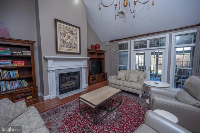 a kitchen with stainless steel appliances granite countertop a refrigerator a sink a stove and a microwave oven