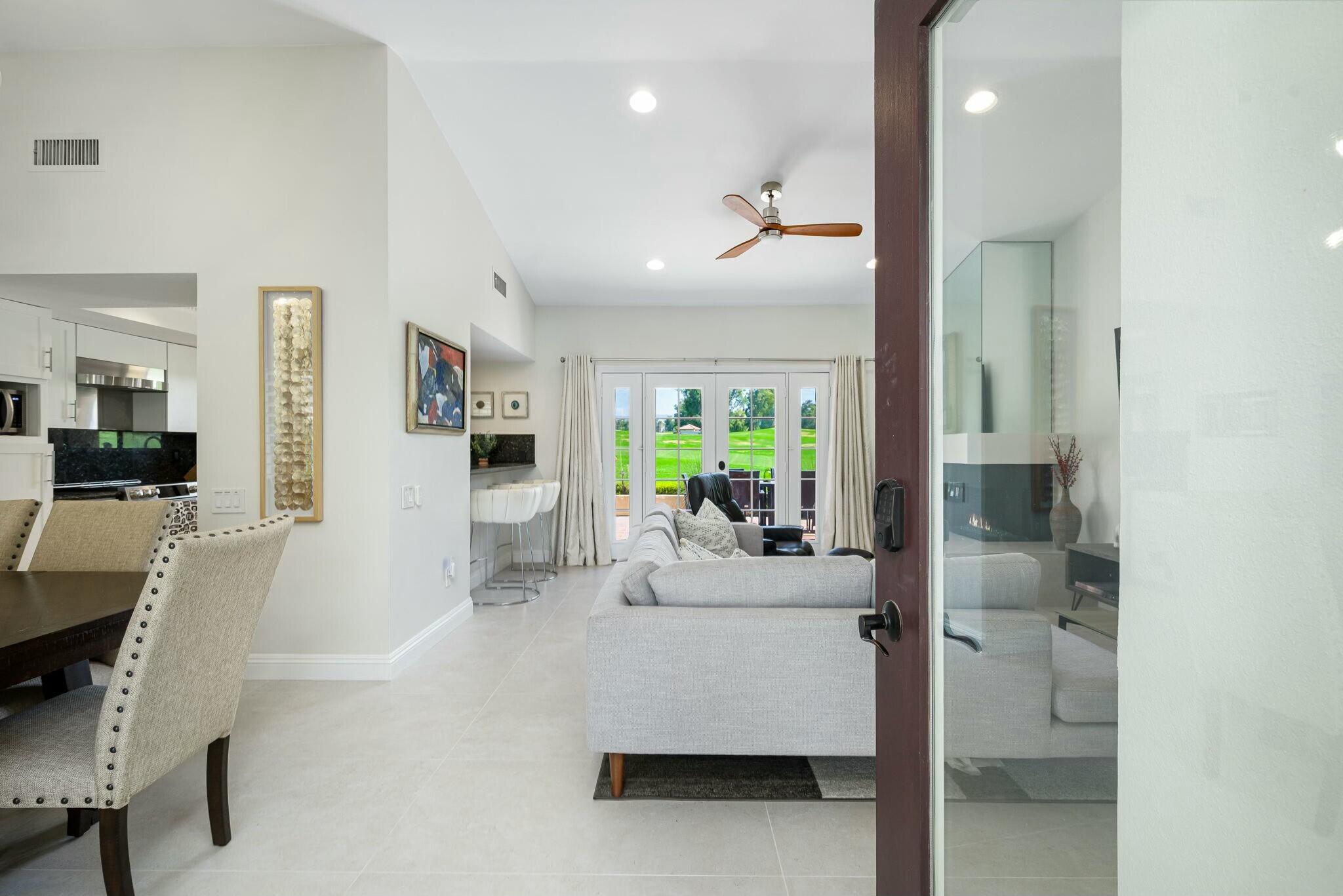 38 Mission Court Rancho Mirage, CA 92270 - Photo 24 of 61 a living room with furniture and a fireplace