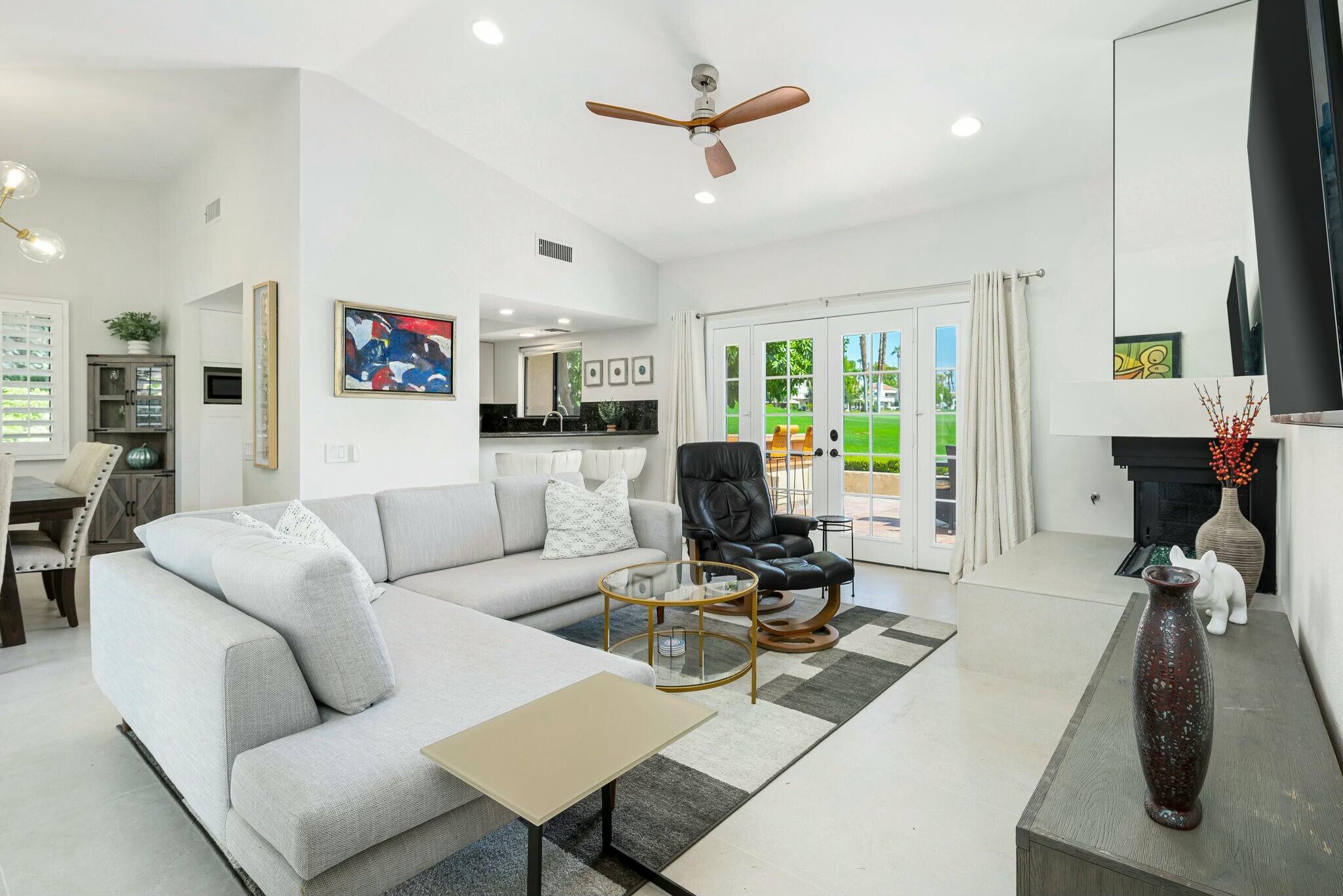 38 Mission Court Rancho Mirage, CA 92270 - Photo 27 of 61 a living room with furniture a window and a flat screen tv
