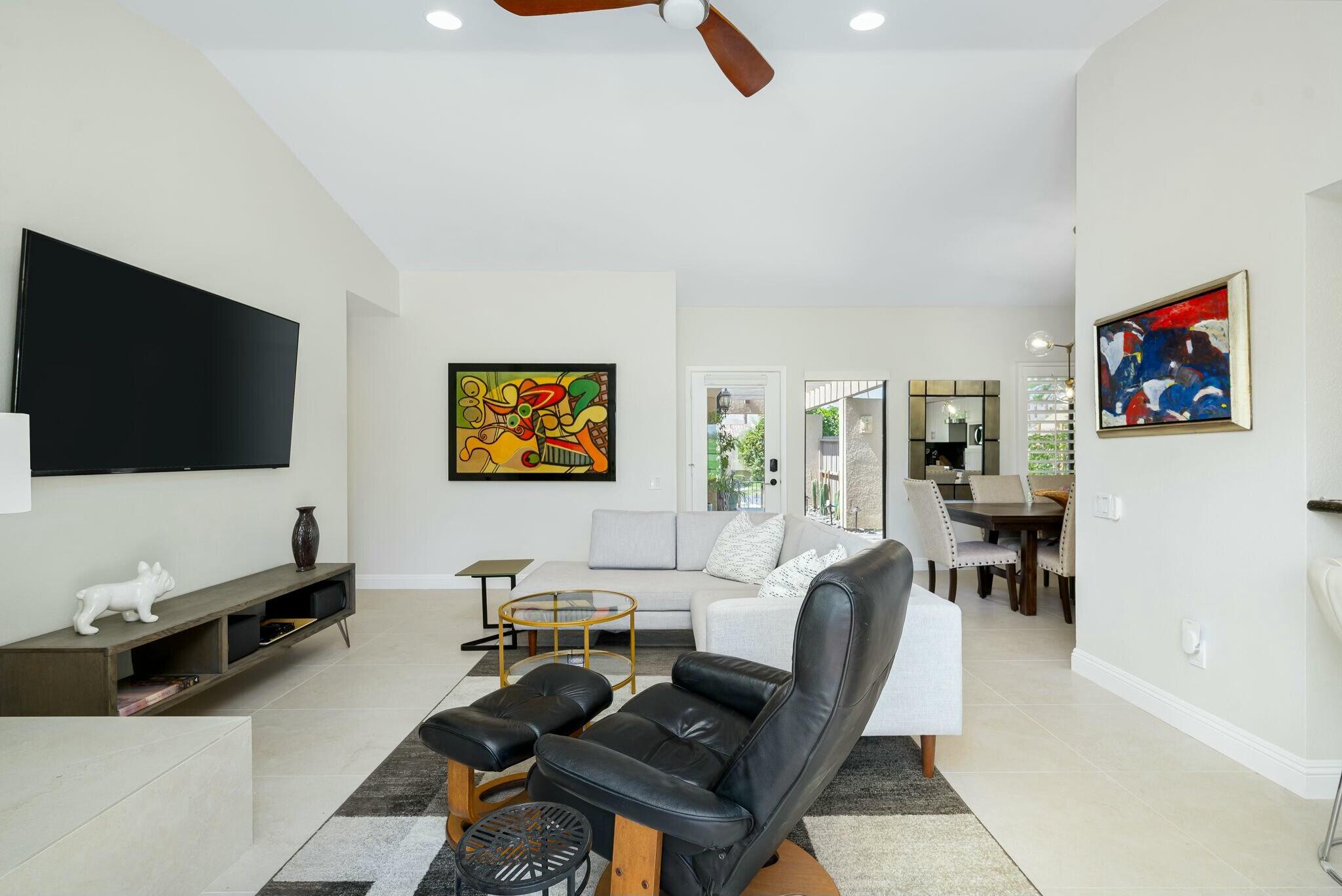 38 Mission Court Rancho Mirage, CA 92270 - Photo 30 of 61 a living room with furniture and a flat screen tv