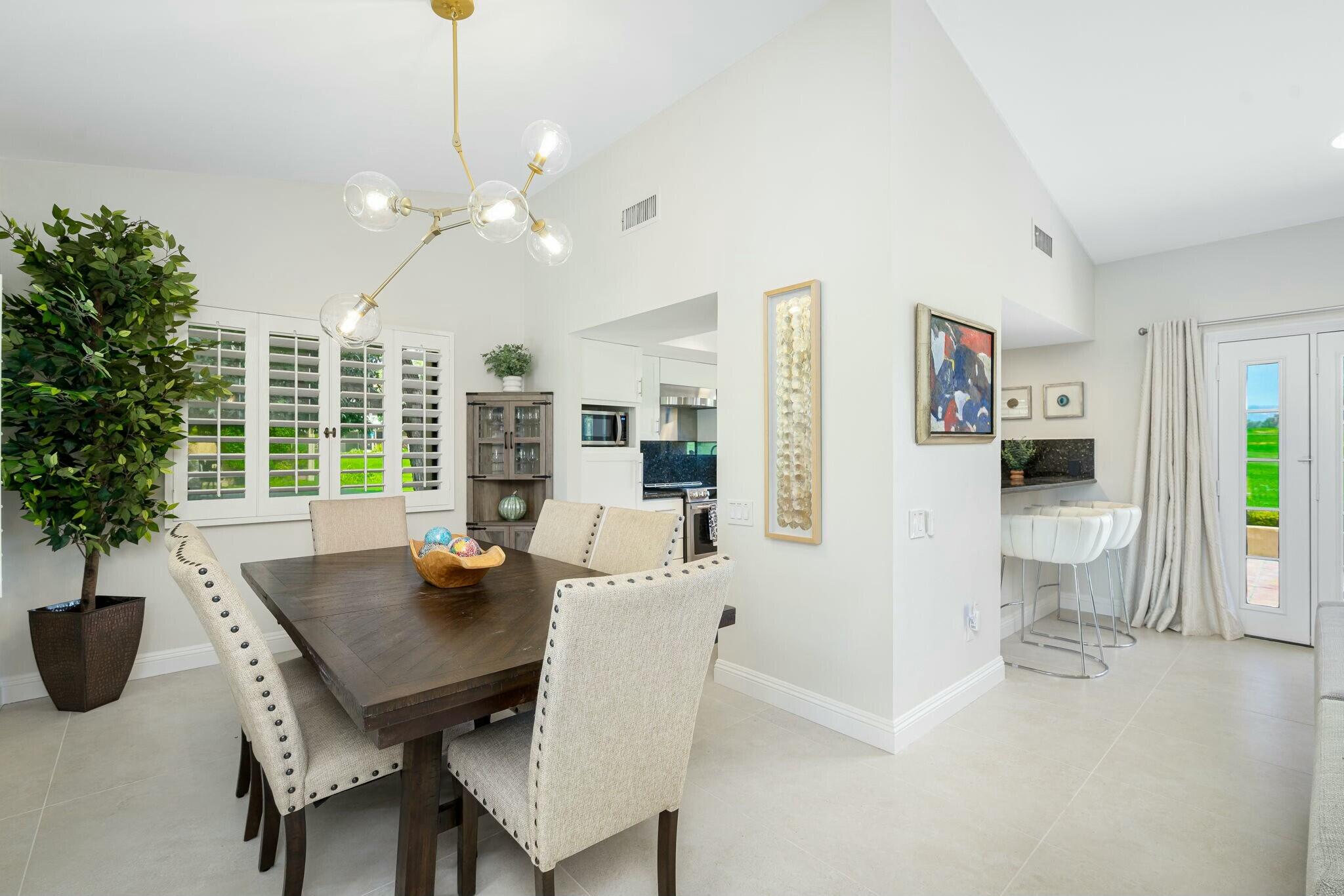 38 Mission Court Rancho Mirage, CA 92270 - Photo 34 of 61 a view of a dining room with furniture window and wooden floor