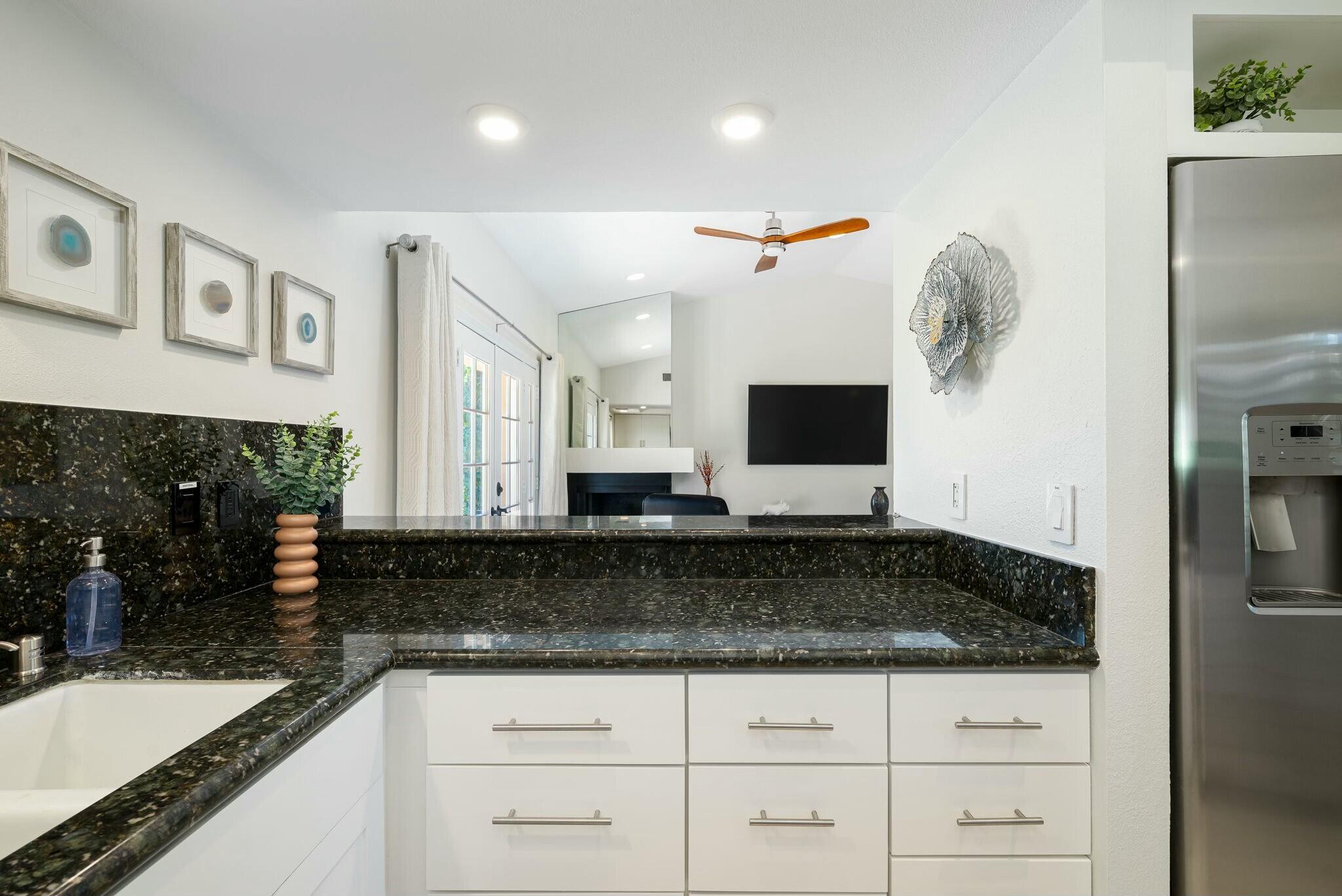 38 Mission Court Rancho Mirage, CA 92270 - Photo 38 of 61 a bathroom with a granite countertop sink and a mirror
