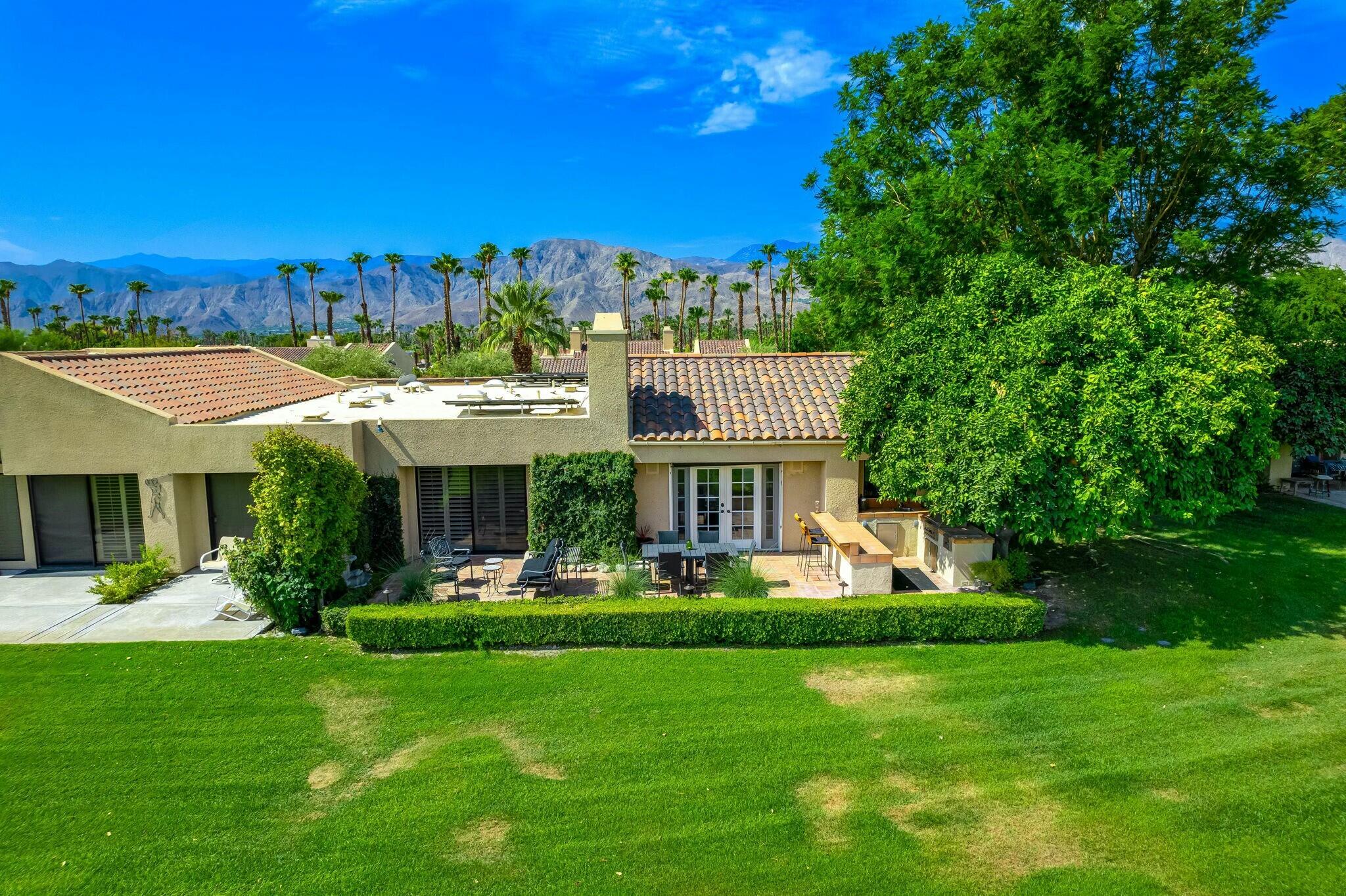 38 Mission Court Rancho Mirage, CA 92270 - Photo 4 of 61 a front view of a house with a yard table and chairs