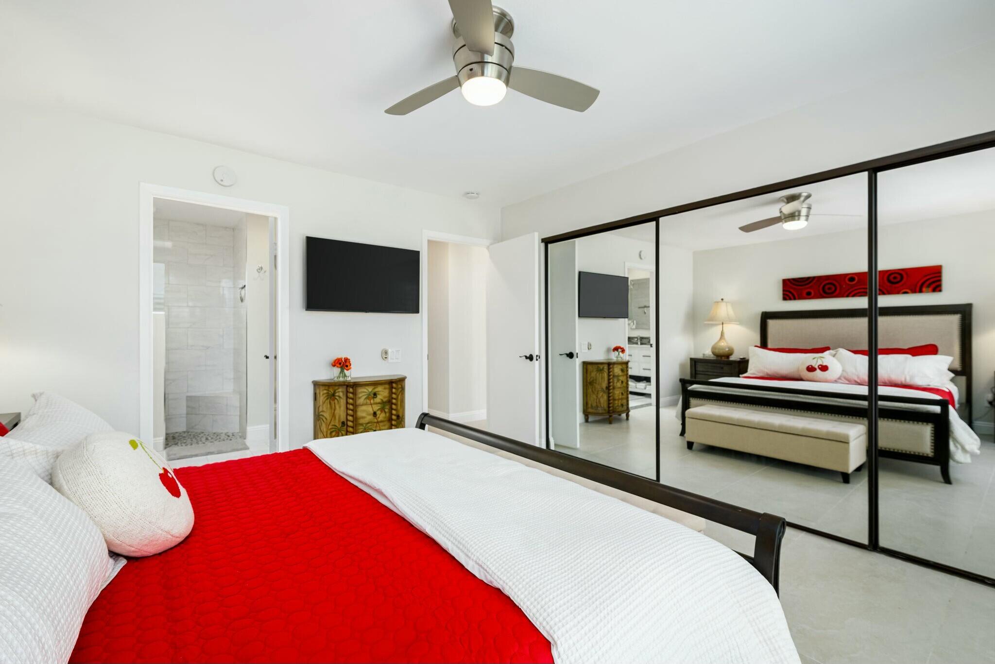 38 Mission Court Rancho Mirage, CA 92270 - Photo 52 of 61 a bedroom with a bed and a flat screen tv