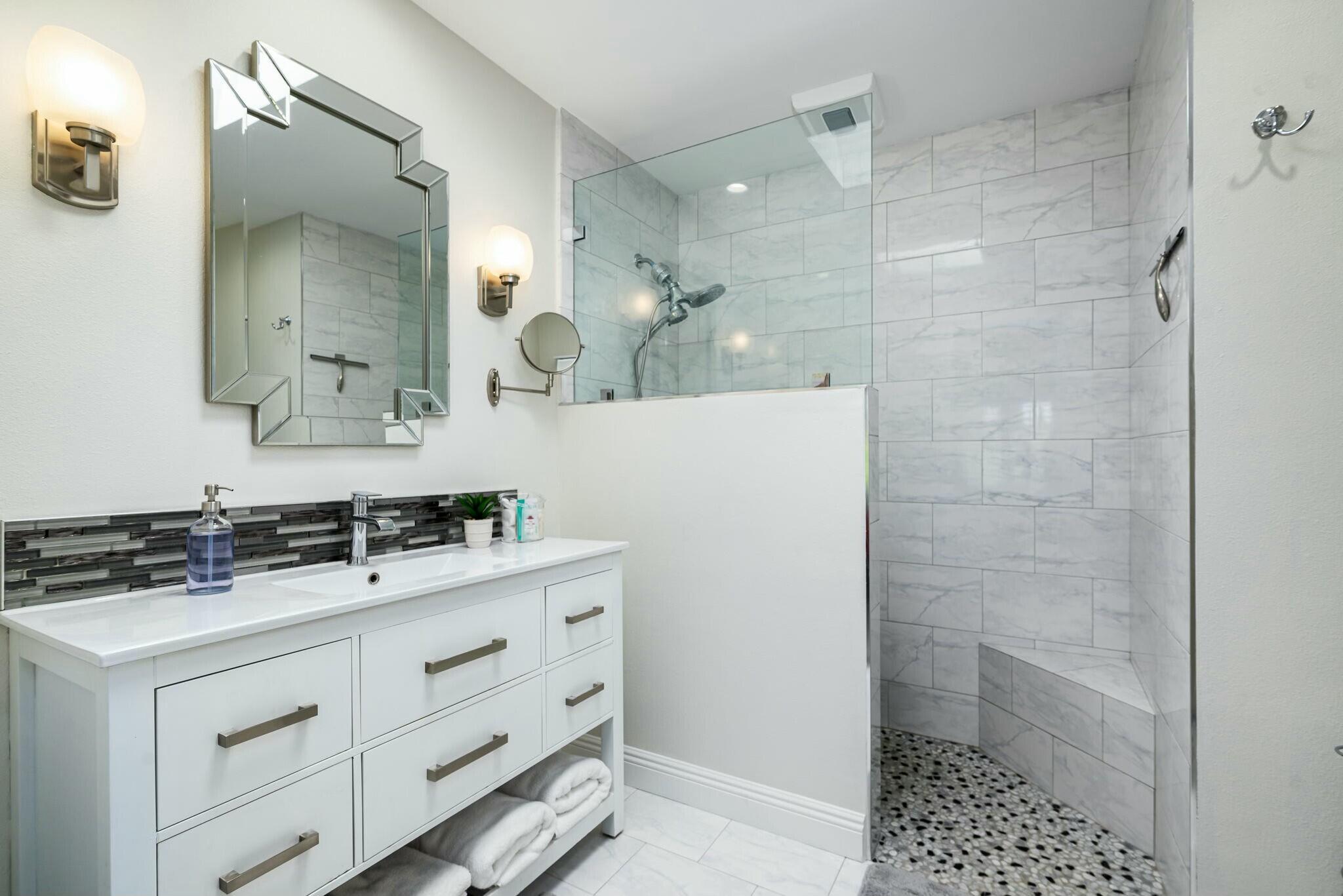 38 Mission Court Rancho Mirage, CA 92270 - Photo 53 of 61 a bathroom with a sink a toilet a shower and a mirror