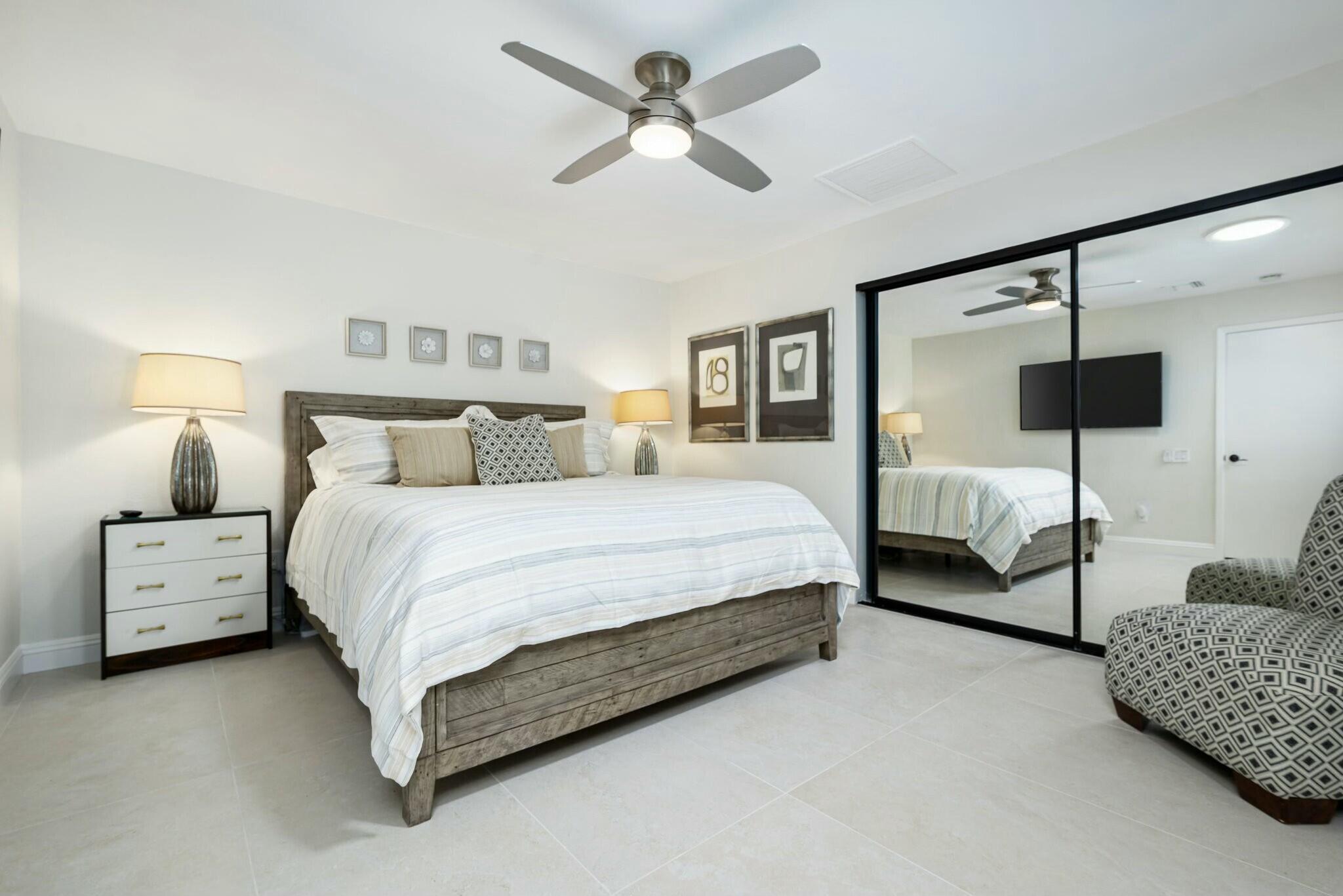 38 Mission Court Rancho Mirage, CA 92270 - Photo 57 of 61 a bedroom with a bed couch and window