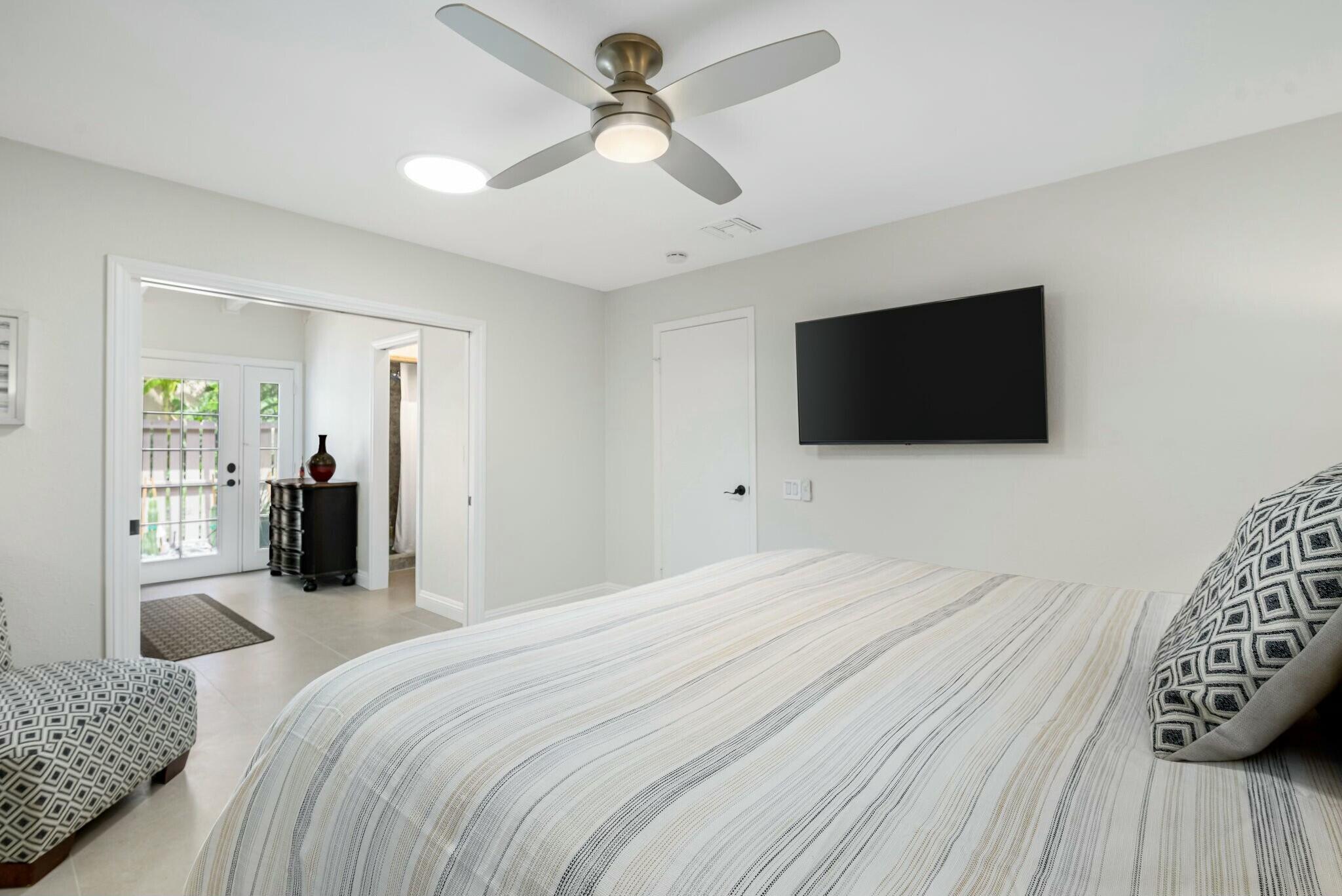 38 Mission Court Rancho Mirage, CA 92270 - Photo 58 of 61 a bedroom with a bed and a flat screen tv