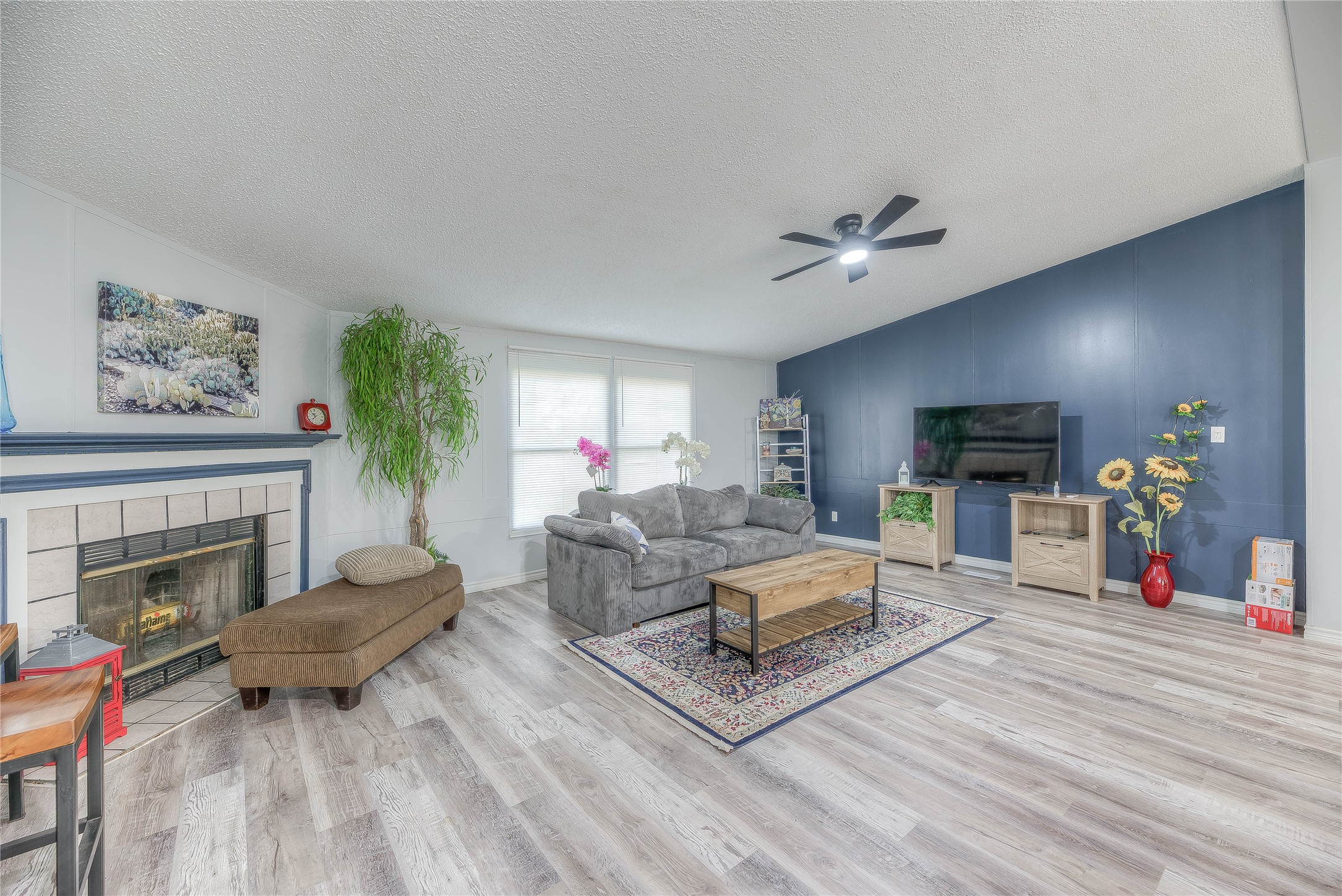 17709 Pine View Drive Conroe, TX 77302 - Photo 10 of 26 a living room with furniture and a fireplace