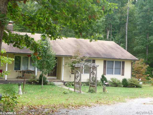 609 Waltons Store Road Louisa, VA 23093 - Photo 2 of 2 a backyard of a house with garden and outdoor seating