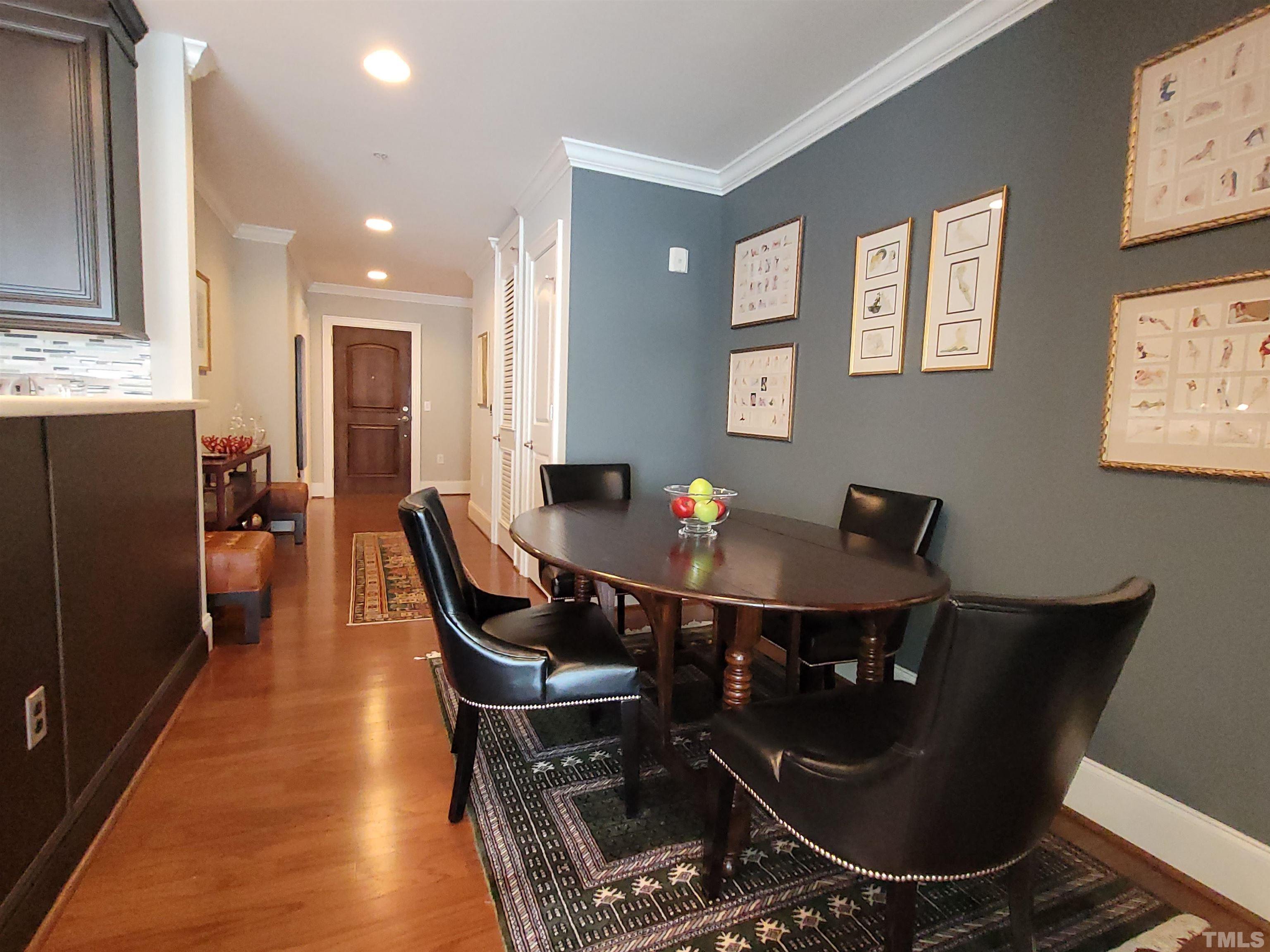 710 Independence Place, Unit 208/2C Raleigh, NC 27603 - Photo 11 of 29 a view of a dining room with furniture