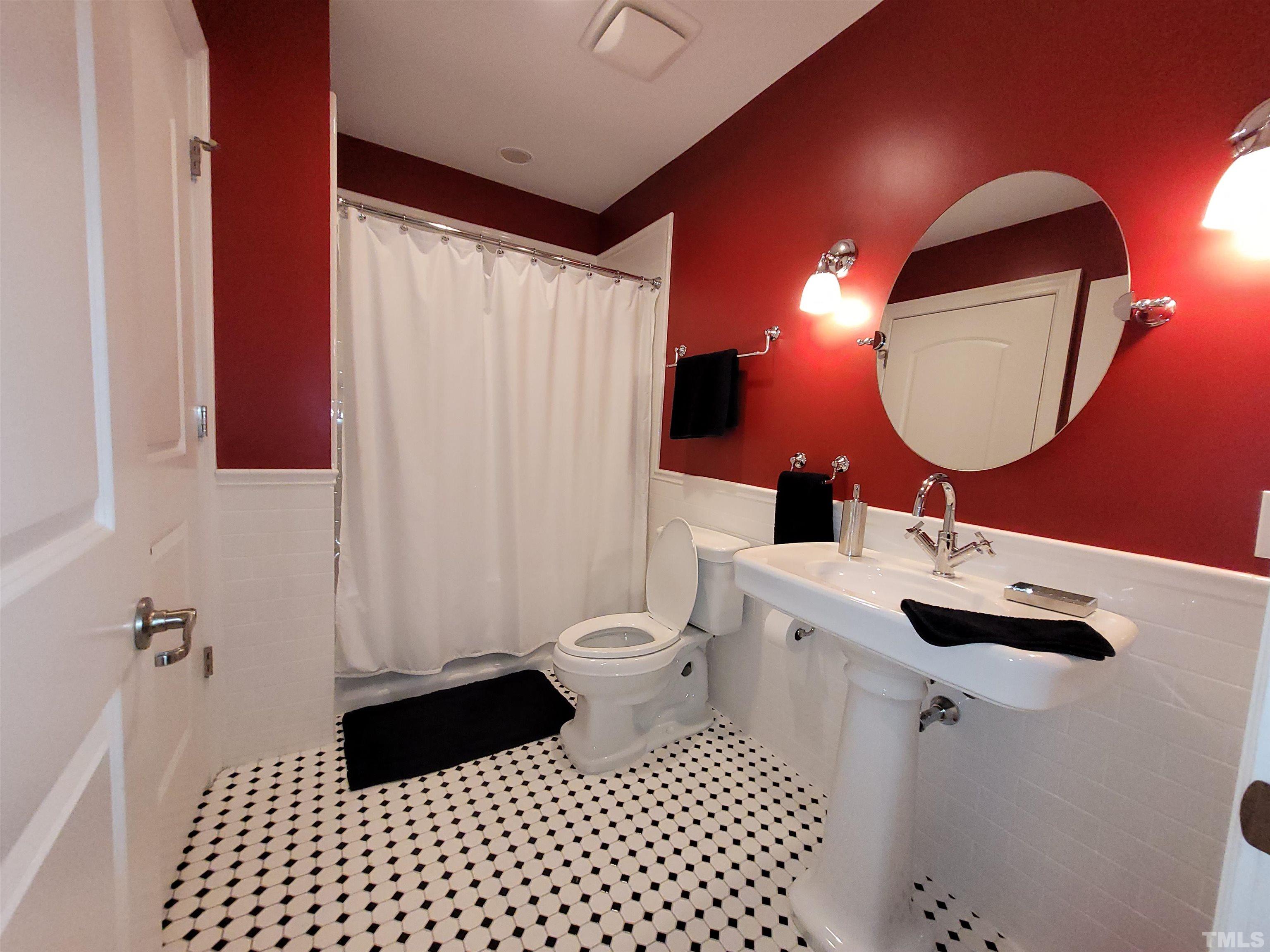710 Independence Place, Unit 208/2C Raleigh, NC 27603 - Photo 14 of 29 a bathroom with a sink toilet and shower