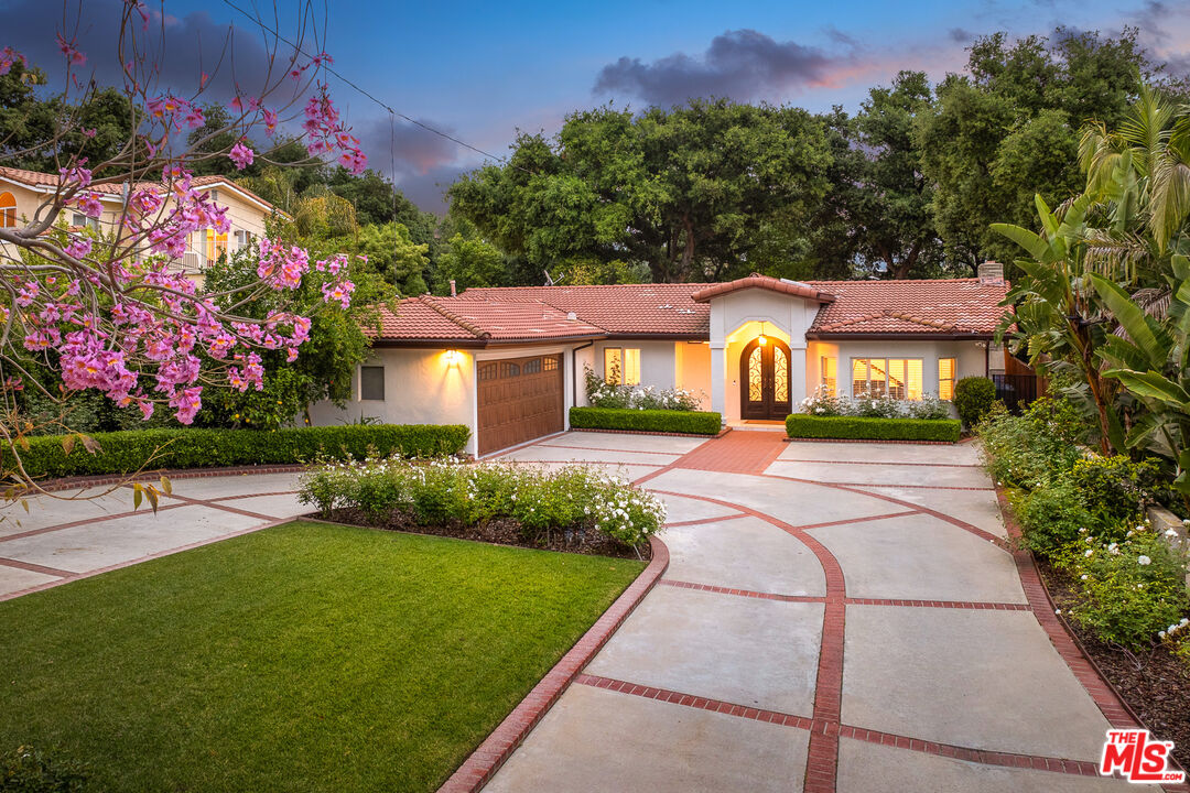 4844 Commonwealth Avenue La Canada Flintridge, CA 91011 - Photo 1 of 43 a view of a house with a yard