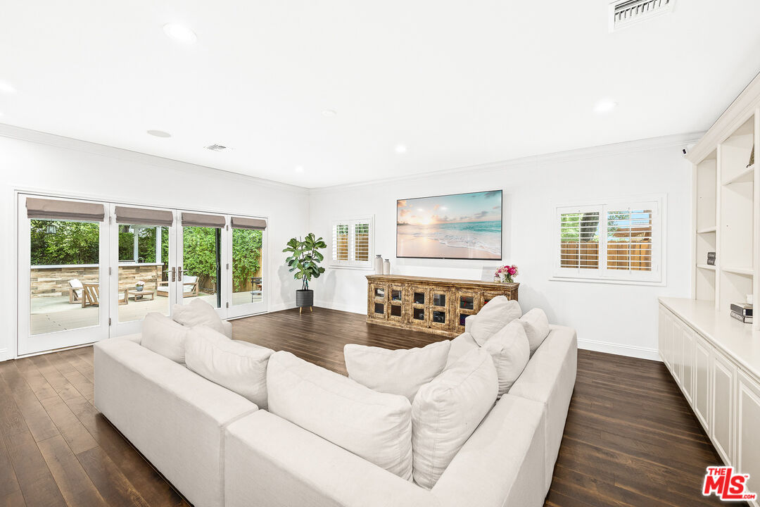 4844 Commonwealth Avenue La Canada Flintridge, CA 91011 - Photo 12 of 43 a living room with furniture and a large window