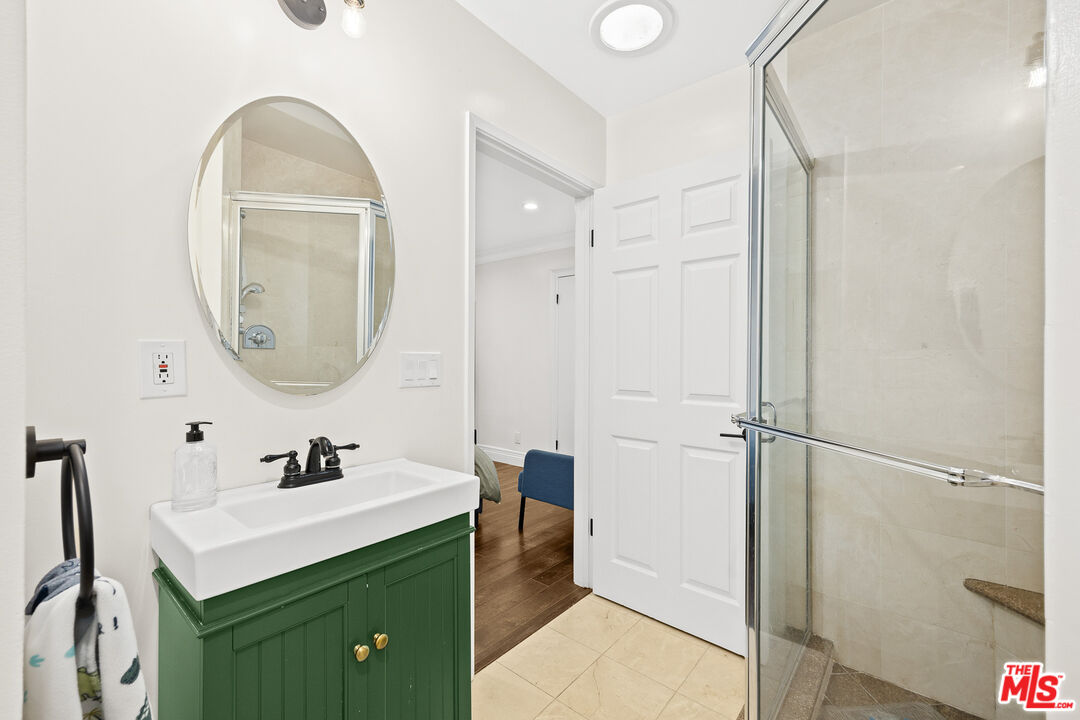 4844 Commonwealth Avenue La Canada Flintridge, CA 91011 - Photo 24 of 43 a bathroom with a sink mirror and a shower