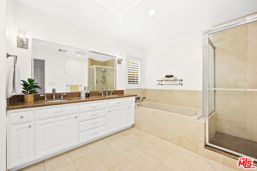 4844 Commonwealth Avenue La Canada Flintridge, CA 91011 - Photo 27 of 43 a spacious bathroom with a tub shower and sink