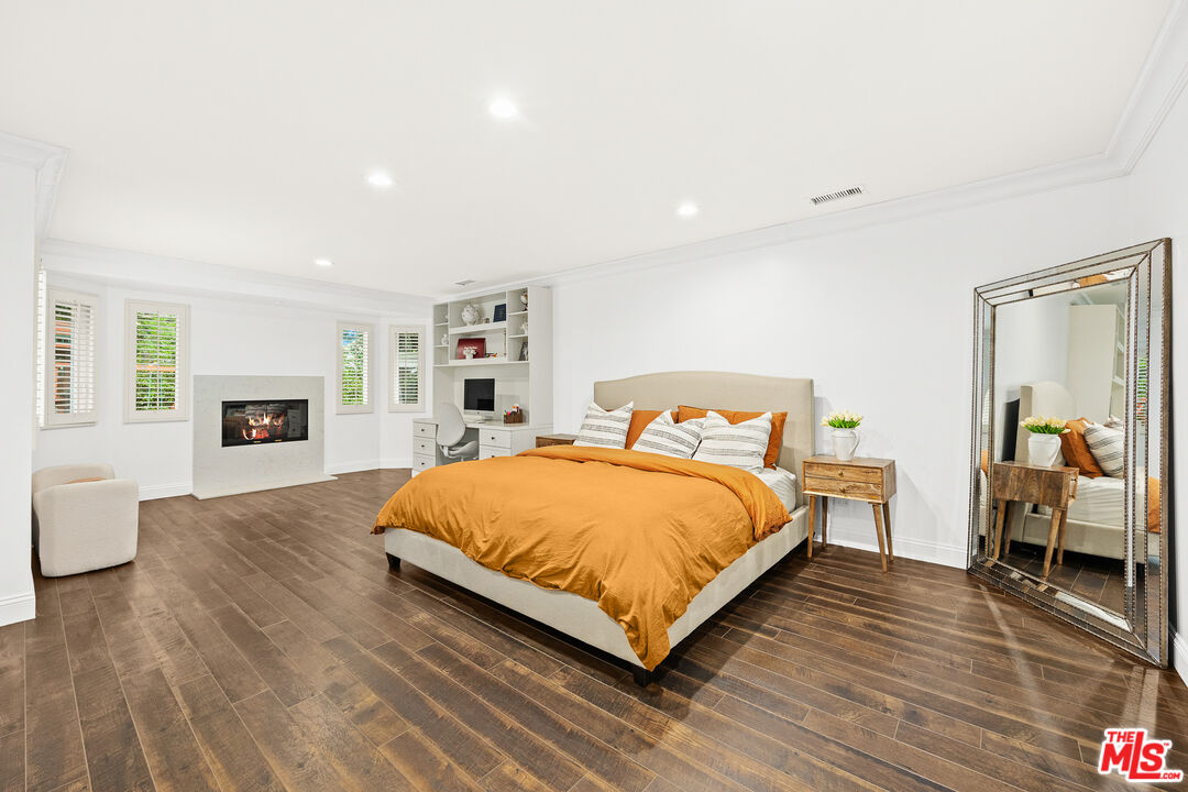4844 Commonwealth Avenue La Canada Flintridge, CA 91011 - Photo 29 of 43 a bedroom with a bed and wooden floor