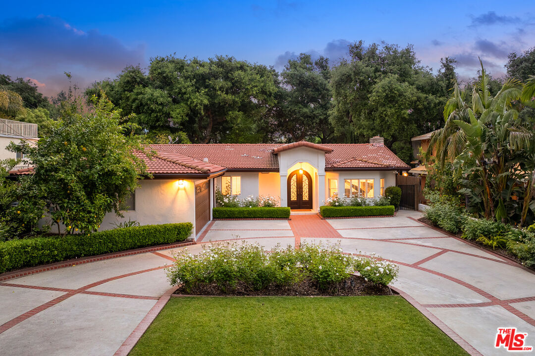 4844 Commonwealth Avenue La Canada Flintridge, CA 91011 - Photo 3 of 43 a front view of a house with garden