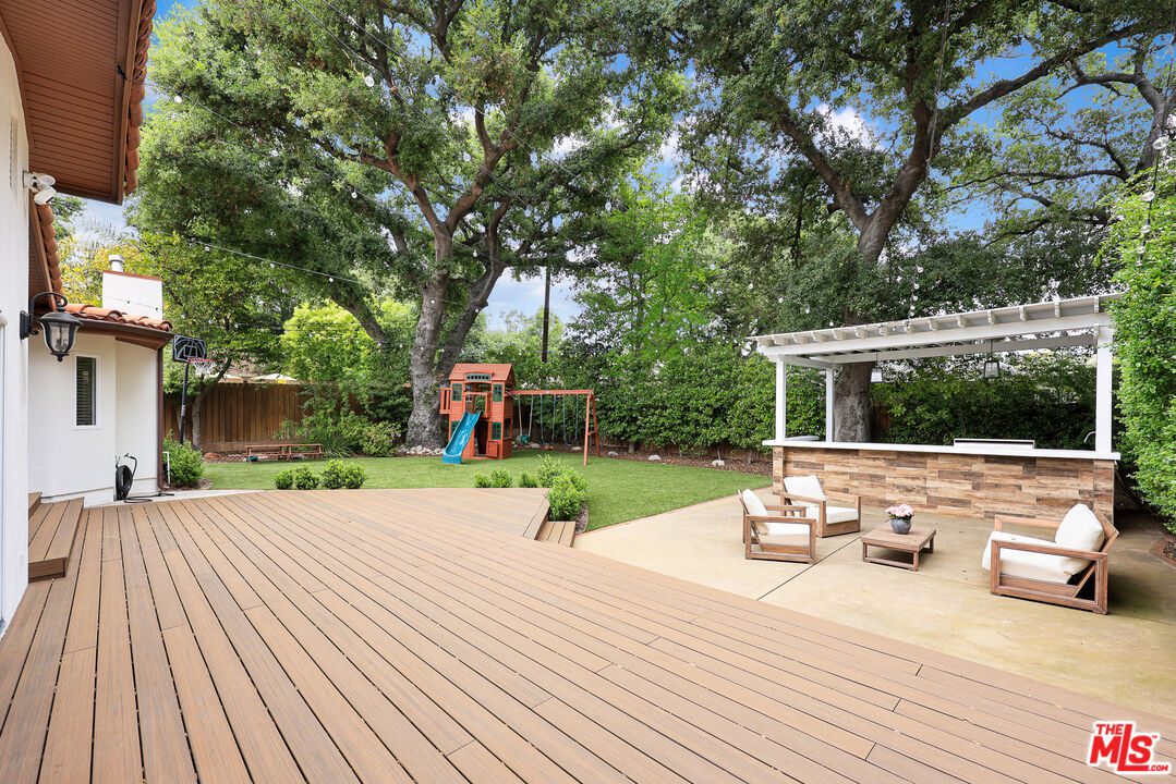 4844 Commonwealth Avenue La Canada Flintridge, CA 91011 - Photo 31 of 43 a view of backyard with seating space and trees