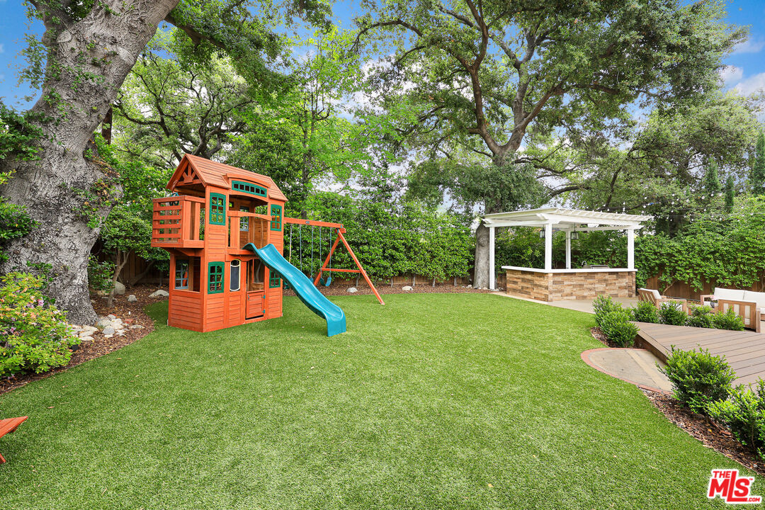 4844 Commonwealth Avenue La Canada Flintridge, CA 91011 - Photo 33 of 43 front view of a house with a yard