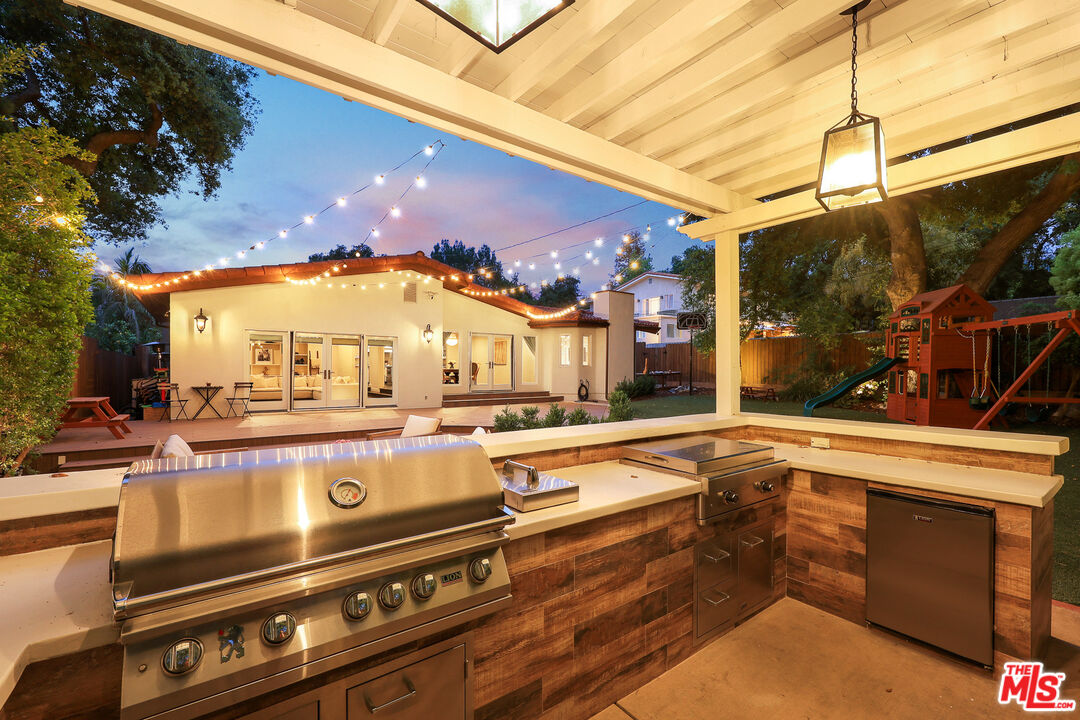 4844 Commonwealth Avenue La Canada Flintridge, CA 91011 - Photo 37 of 43 a view of a patio with a table and chairs