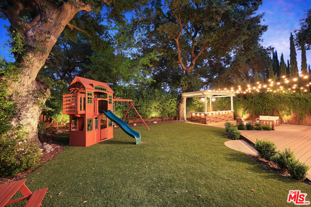 4844 Commonwealth Avenue La Canada Flintridge, CA 91011 - Photo 40 of 43 a childrens park with lots of swings and slides and large trees