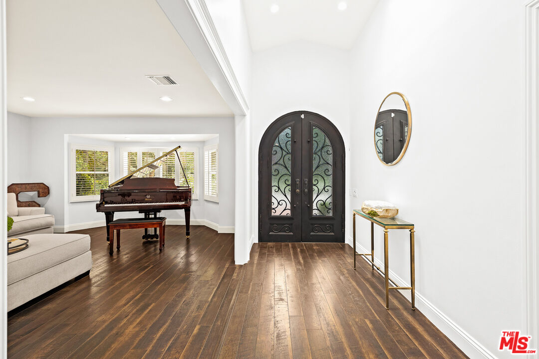 4844 Commonwealth Avenue La Canada Flintridge, CA 91011 - Photo 9 of 43 a living room with furniture and a wooden floor