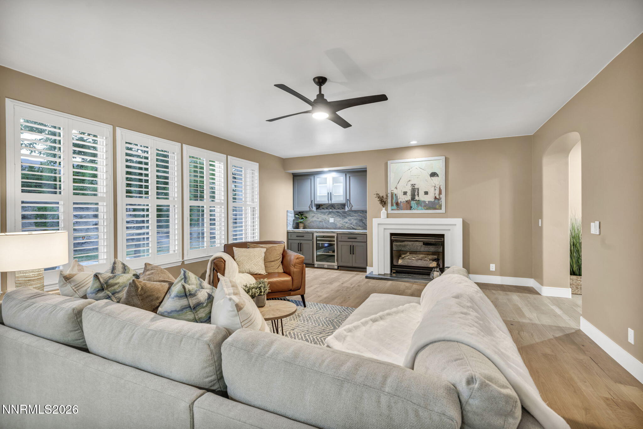 2965 Roundrock Court Reno, NV 89511 - Photo 11 of 40 a living room with furniture a large window and a fireplace