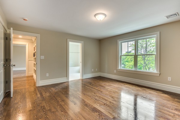 14 Hamblen Street Lexington, MA 02421 - Photo 23 of 29 an empty room with wooden floor and windows