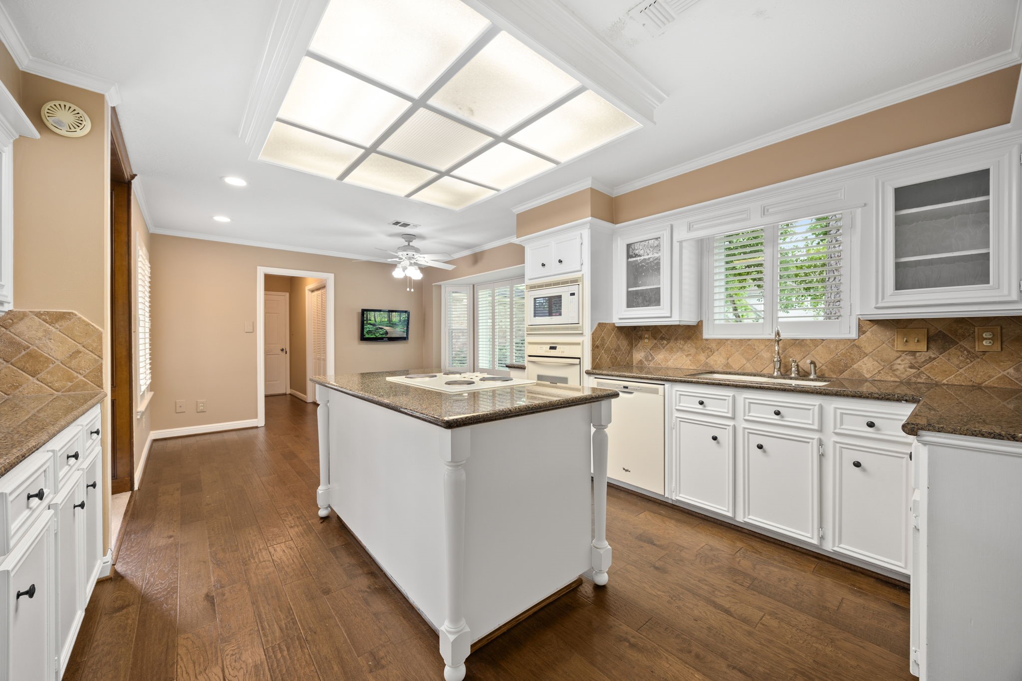 6623 Ampton Drive Spring, TX 77379 - Photo 15 of 45 Look at the bright light, picture windows, plantation shutters, and flawless flooring.