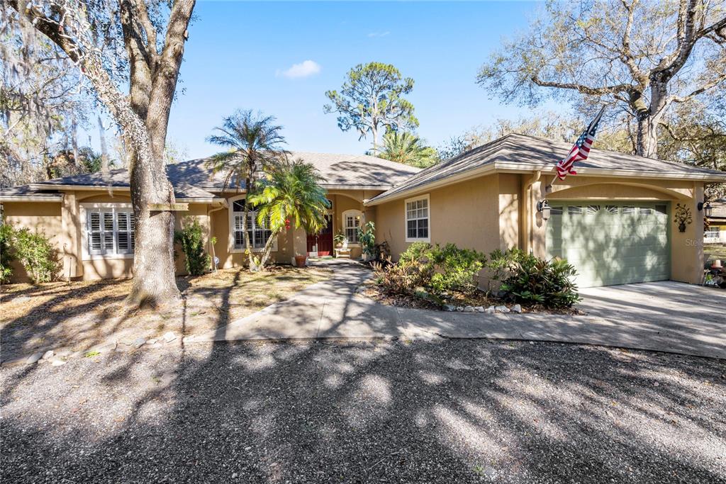 a view of a house with a yard
