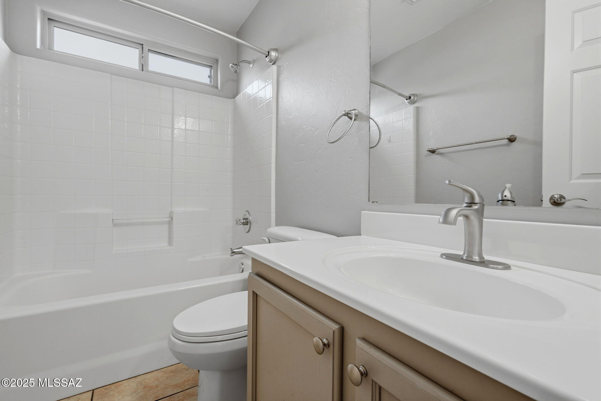 8244 South Lost Mountain Road Tucson, AZ 85747 - Photo 30 of 41 a bathroom with a sink a toilet and a bathtub