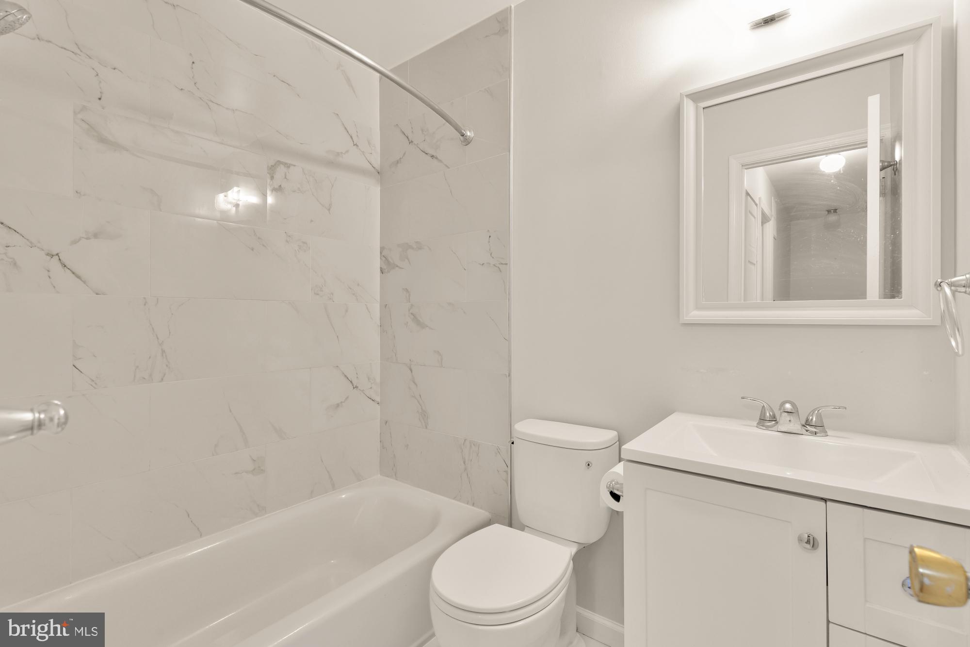 7149 Mill Run Drive, Unit 155 Rockville, MD 20855 - Photo 15 of 22 a bathroom with a sink toilet and shower