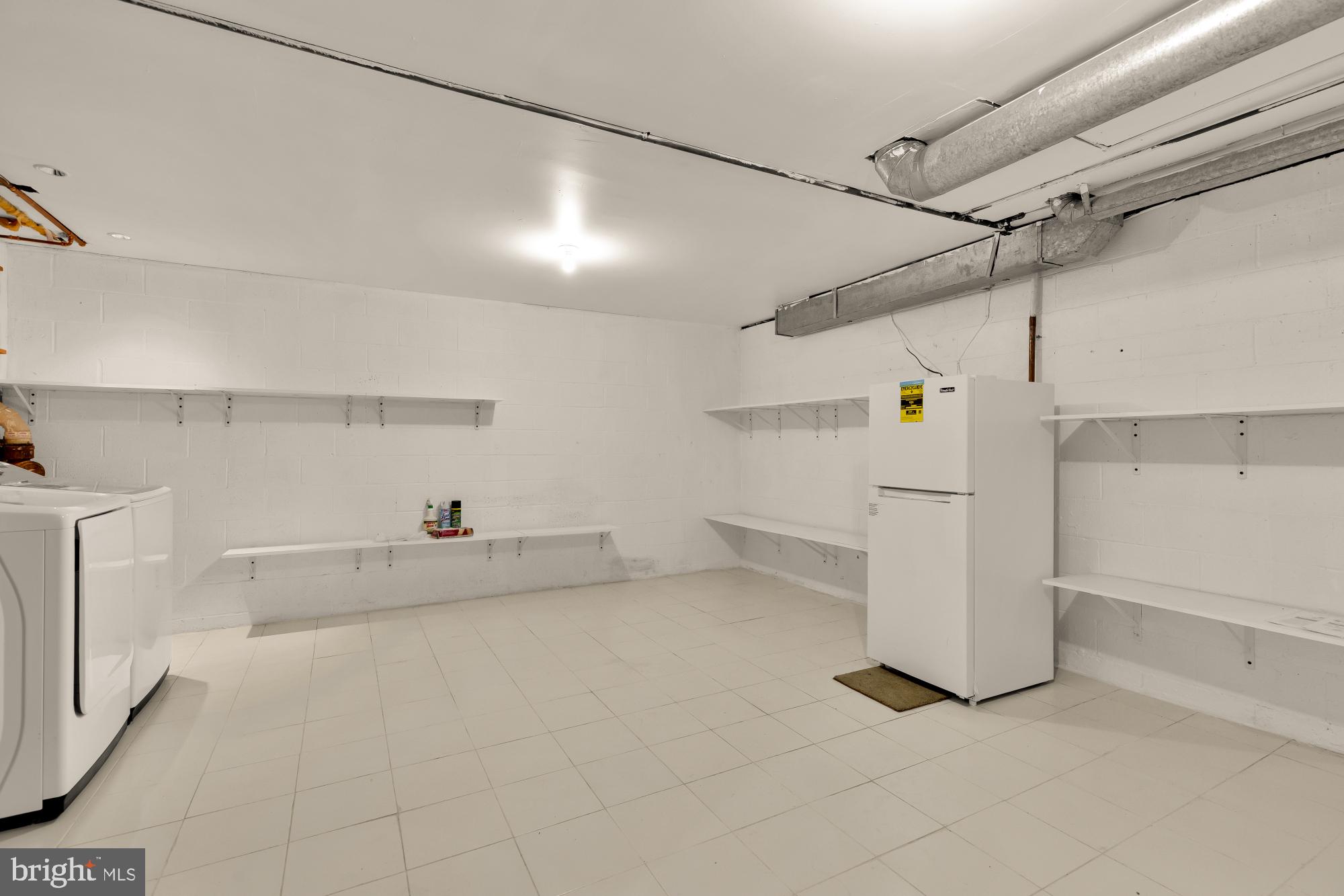 7149 Mill Run Drive, Unit 155 Rockville, MD 20855 - Photo 18 of 22 a view of a storage & utility room with racks on the wall