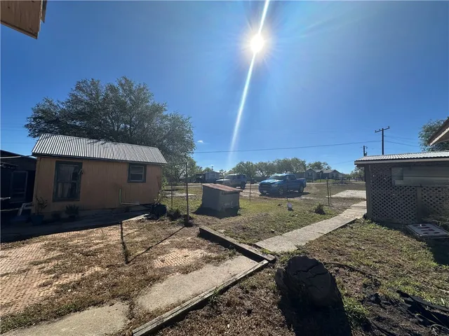 a bedroom with a bed and a television