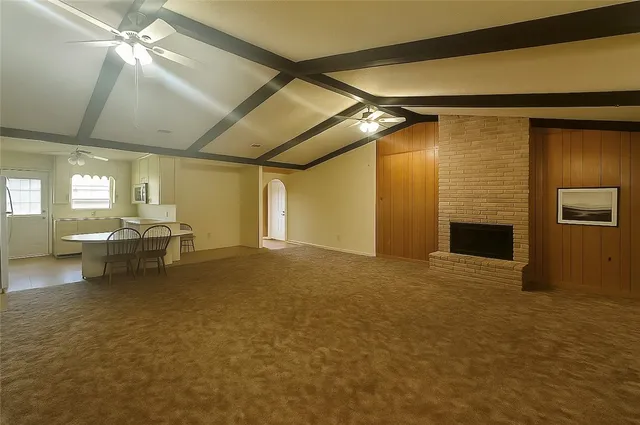 a view of a livingroom with furniture and a fireplace