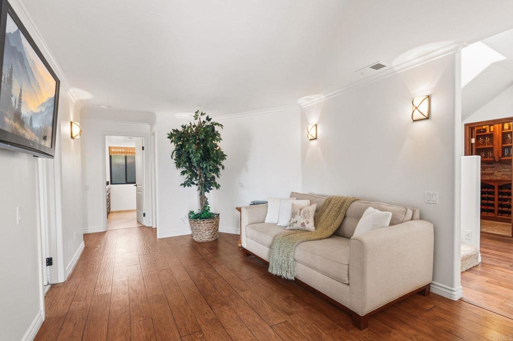 13319 Pacer Lane Poway, CA 92064 - Photo 33 of 75 a living room with furniture and a wooden floor