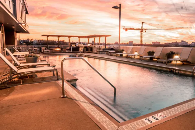 a view of swimming pool with outdoor seating