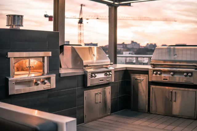 a kitchen with a stove a sink and a microwave