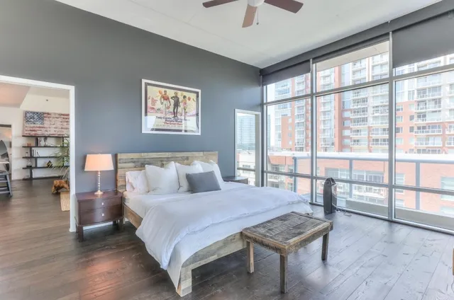 a bedroom with a large bed and a table