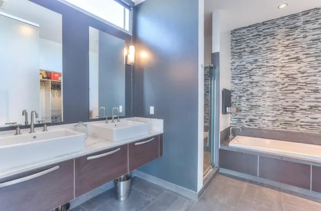 a bathroom with a bathtub and a sink