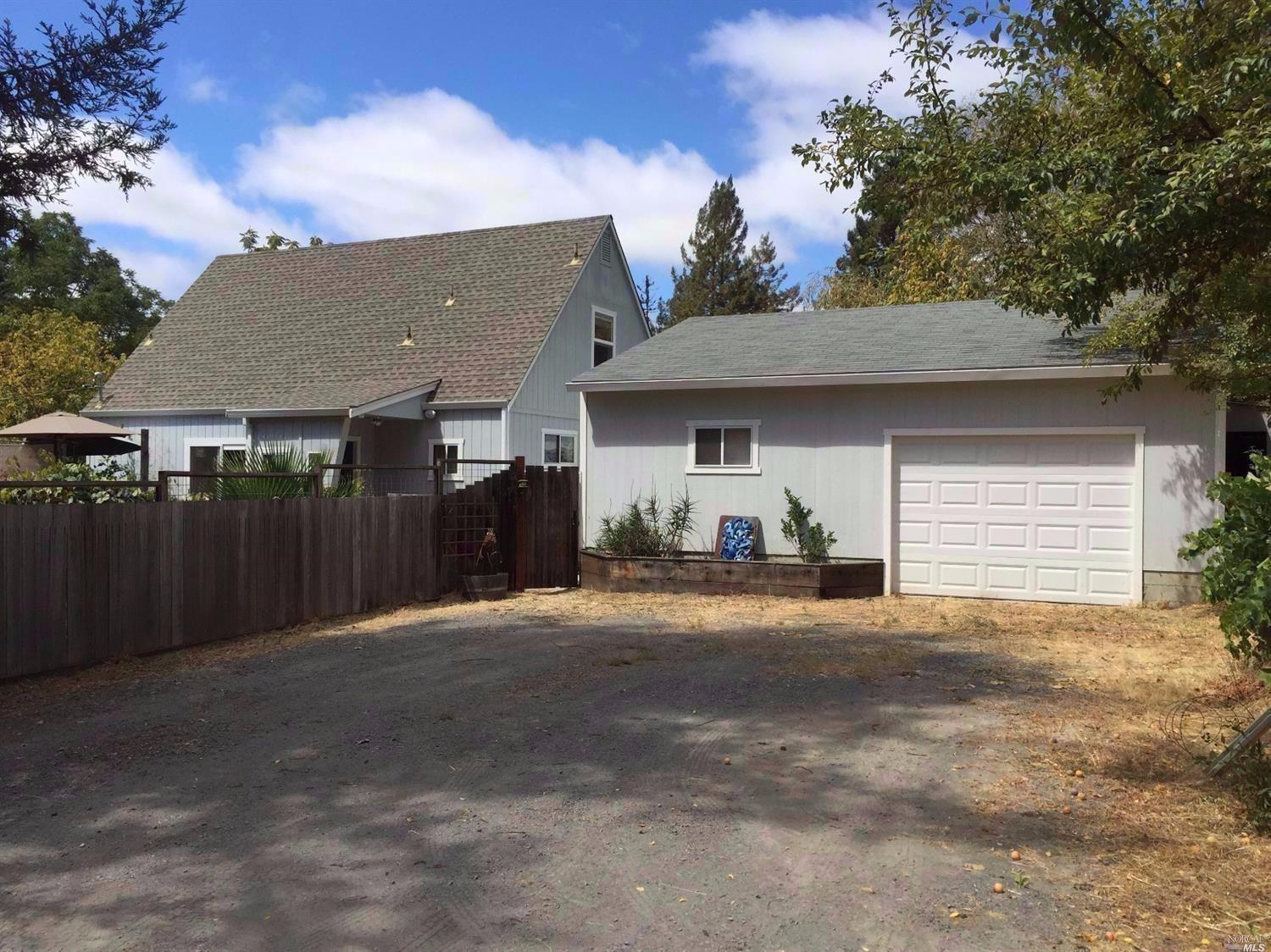 9036 Green Valley Road Sebastopol, CA 95472 - Photo 1 of 1 a front view of a house with a garage