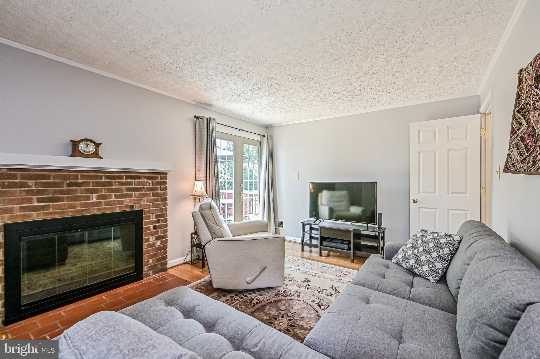 1333 Deep Run Lane Reston, VA 20190 - Photo 16 of 48 Family room with wood burning fireplace