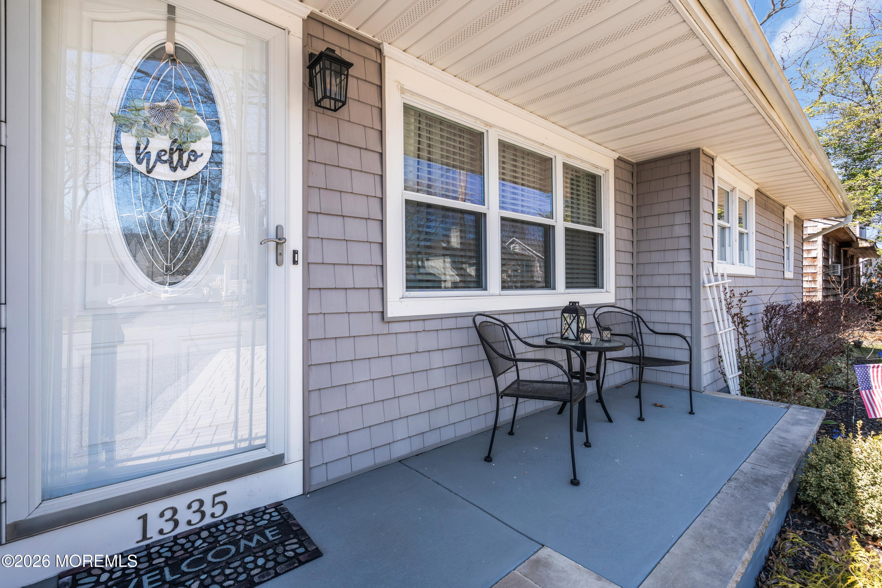 1335 Sunrise Avenue Point Pleasant, NJ 08742 - Photo 11 of 51 a view of a house with a porch and a bench